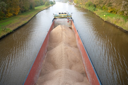 barge with sand on a canal