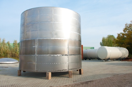 shiny silo stored outside for further processingの写真素材