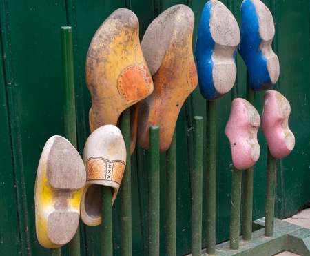 colorful wooden shoes stored on a rack