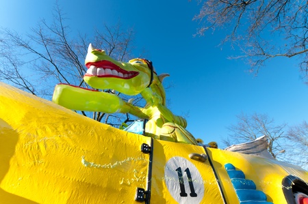 OLDENZAAL, NETHERLANDS - MARCH 6, 2011: Large green dragon as part of the great carnival parade. This parade is the largest in the eastern Netherlands with around 100,000 spectators.のeditorial素材