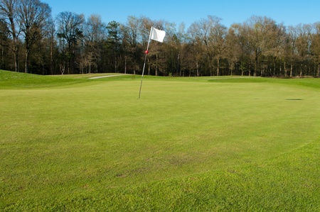 golf course with white flagの写真素材