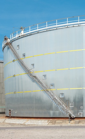 large grey tank for petrol and oil in the Rotterdam harbor