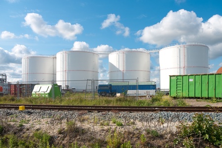 white fuel tanks in amsterdam harborの写真素材