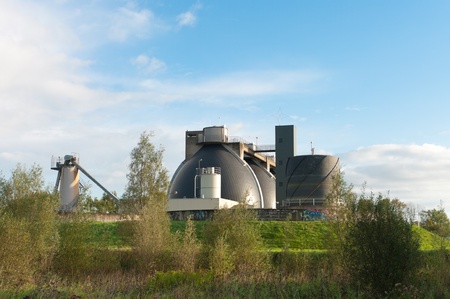 silos where bio gas is made out of sewage sludge and used by the water treatment plant for their energy needsの写真素材