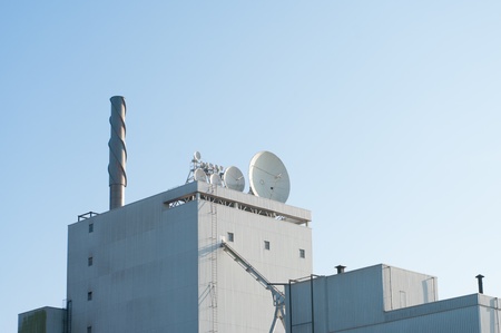 satellite dishes on top of a buildingの写真素材