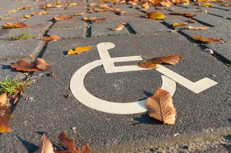 disabled parking permit sign painted on the streetの写真素材