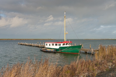 fishing trawler with small boat の写真素材