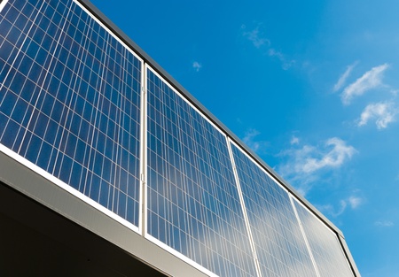 solar panels against a blue sunny skyの写真素材