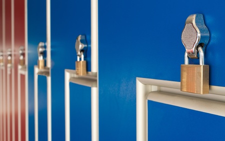 safety locks on blue industrial metal lockersの写真素材