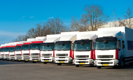 several trucks parked in a perfect rowの写真素材