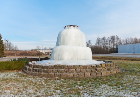 completely frozen fountain in Oldenzaal, Netherlandsの写真素材