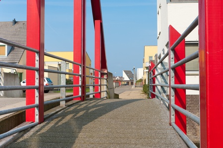 modern red footbridge in Beuningen, Netherlandsの写真素材