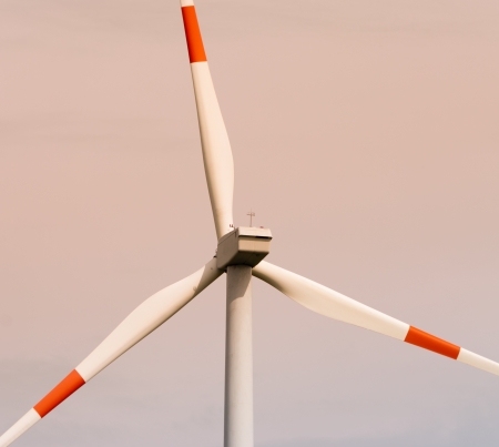 closeup of a windmill with red and white bladesの写真素材