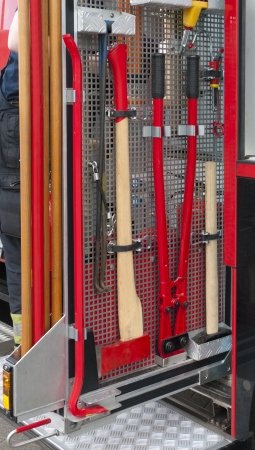 fire truck tools hanging in a rack