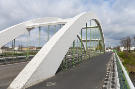 concrete white arch bridge in Enschede, Netherlandsの写真素材