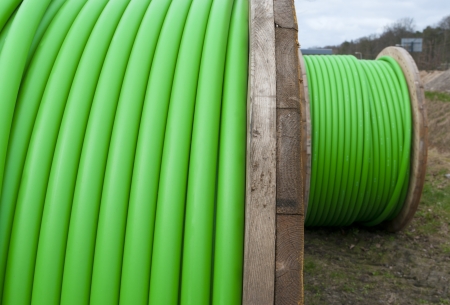 cable drum with green cable on itの写真素材