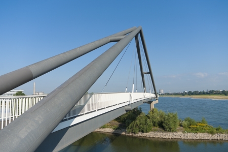 modern abstract footbridge at the parlamentsufer in Dusseldorf, Germanyの写真素材