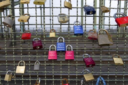 lockers at the Hohenzollern bridge in Cologne, Germany symbolize love for ever. Since 2008 people have placed love padlocks on the fence between the sidewalk and the tracks. Dutch band Nits dedicated a song to this in the song "Love Locks" from their 2012のeditorial素材