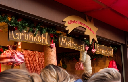 food stand at the christmas market in Cologne, Germany selling traditional german food. It's one of the largest in the country with 7 separate markets all in the city centerの写真素材