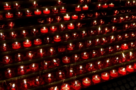 lots of red candles in a churchの写真素材