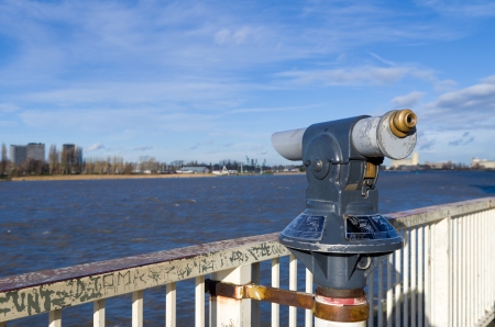 telescope over de schelde river in antwerp, belgiumの写真素材