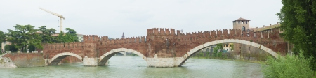 panorama of mediaval stone bridge of Scaliger in Verona, Italy. The segmental arch bridge featured the world's largest span at the time of its construction.の写真素材