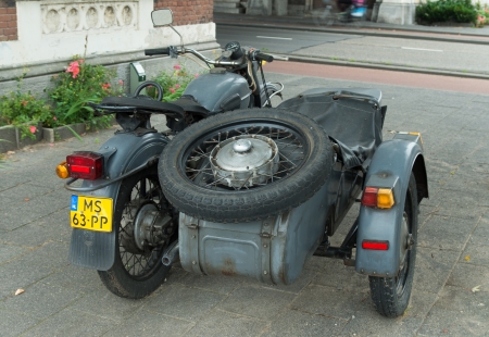 antique Ural motor with sidecar in rotterdam, netherlands. IMZ-Ural  is a Russian maker of heavy sidecar motorcycles. The origins of the IMZ-Ural are linked to developments in the Eastern Front during World War II.のeditorial素材