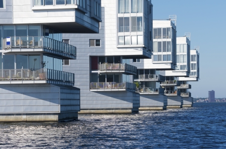 modern apartments at a lake shore in the netherlandsの写真素材