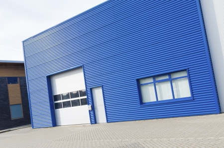 facade of a modern blue warehouseの写真素材