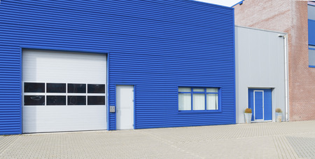 facade of a modern blue warehouseの写真素材