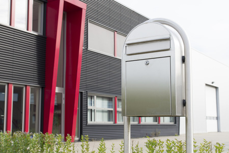 aluminum mail box in front of a modern office buildingのeditorial素材