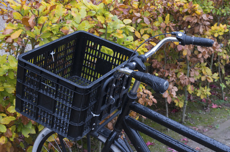 basket on a black bicycleの写真素材