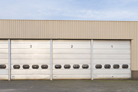 damaged and weather-beaten numbered loading docksのeditorial素材