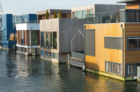 Houses in IJburg, a eastern residential area of Amsterdam. It is built on several artificial islandsの写真素材