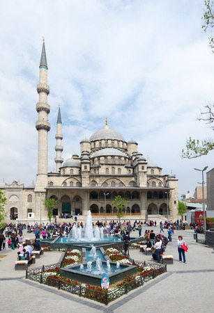people in front of the new mosque or Yeni Camii in Istanbul  It is an Ottoman imperial mosque, located in the Eminonu district of Istanbul  It is one of the best known sites of the cityのeditorial素材