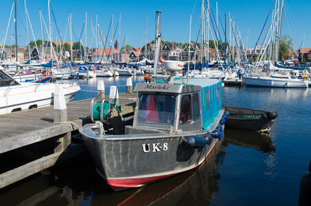 old fishing boat with Urker registration number. Urk has by far the largest fishing fleet and fish processing industry in the Netherlands.のeditorial素材