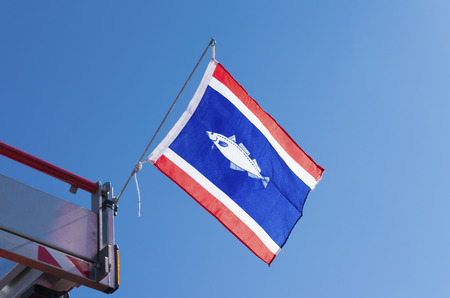 official flag of the fishing village Urk in the netherlands. The municipality of Urk differs in economic, religious and demographic as well as on the average income, largely on the Dutch averages.の写真素材