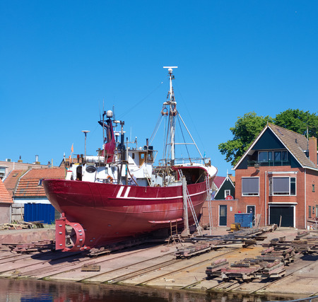 fishing boat in dry dock in Urk, Netherlands. Urk has by far the largest fishing fleet and fish processing industry in the Netherlands.のeditorial素材