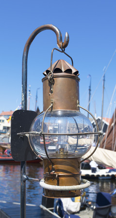 brass ship lantern in dutch harborの写真素材