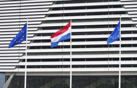 dutch flag in between flags of the european union