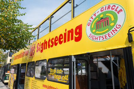 yellow city sightseeing bus in Berlin. It's a hop-on/hop-off system where tourists can join the tour...