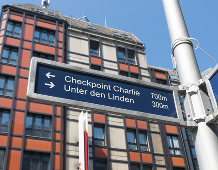 street sign in the famous Friedrichstrasse in Berlin with some wellknown landmarks on itの写真素材