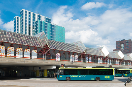 exterior of the almere train and bus station in the netherlands. The station opened may 1987 and is designed by Peter Kilsdonk. The bus station lies under the train stationのeditorial素材
