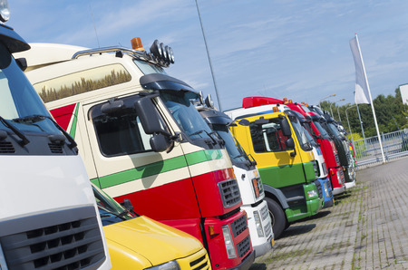 colorful parked trucks on a parking placeの写真素材