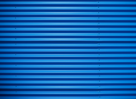close-up of a blue steel wall of an industrial buildingの写真素材
