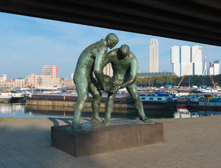 statue of two dike workers, created by Ek van Zanten. it symbolizes the cooperation in the fight against the seaのeditorial素材