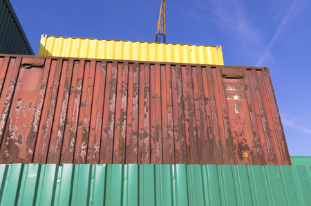 piled up cargo containers in the port of rotterdam