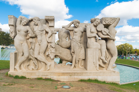 One of the two sculpture groups in front of the palais de Chaillot in paris. La Joie de vivre by LÃ©on Driveir and La Jeunesse by Pierre-Marie Poisson, stand on the lawns at the bottom of the fountain.の写真素材