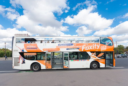 French tourist bus on the Bir-Hakeim bridge in front of the famous eiffel tower in paris