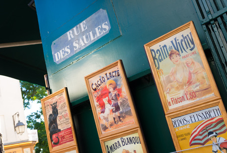 vintage affiches in the art district montmartre in paris, franceのeditorial素材